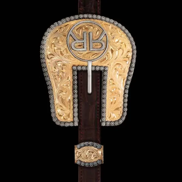 Our Trakehner Headstall Buckle is western elegance through and through. Handcrafted on a Jeweler's Bronze base,  where simplicity shines from the hand-engraved base to the German Silver Ranch brand and classic berry edge. Customize your headstall with you